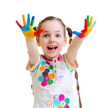 Happy young girl with fingerpaint on her hands